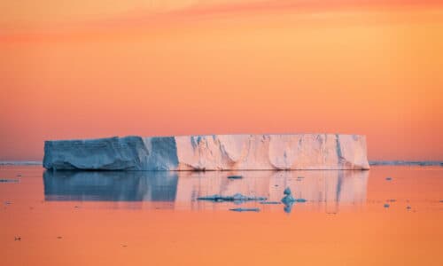 Camille Seaman, Tabular Iceberg at Dawn on the Solstice in the Weddell Sea, Antarctica, December 22, 2021 from the series "Matter of Time", 2023, photographic print, edition 2 of 9, 20 x 30 inches, Newport Art Museum, Museum Purchase with funds provided by Karl and Teryn Weintz, 2023.002.002.